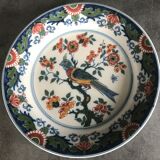 Wall plate in earthenware decorated with painting of flowers and bird 28 cm