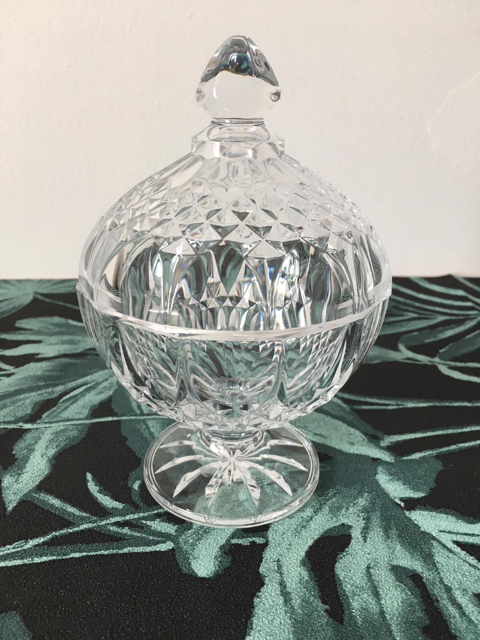 Antique sugar bowl or candy dish on a stand. Made of molded and cut crystal.