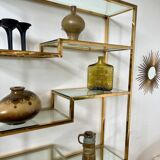 Old shelf in golden metal brass geometric library design 80s vintage