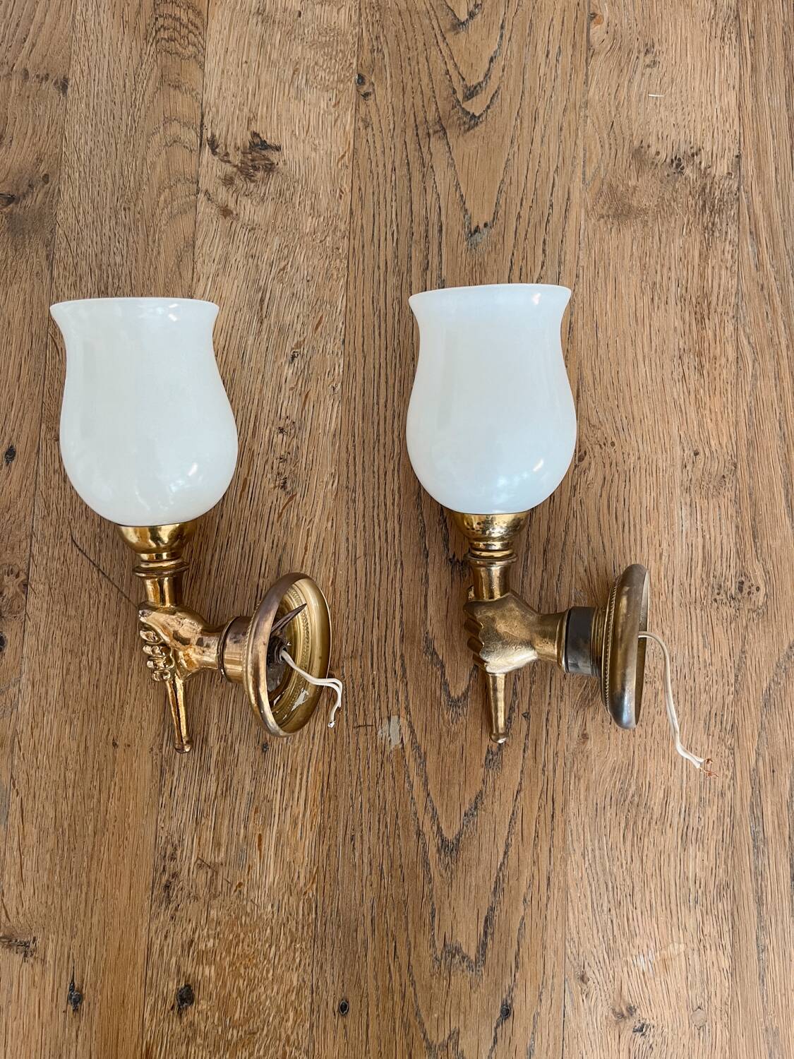 Set of 2 golden, bronze and brass torch wall lights