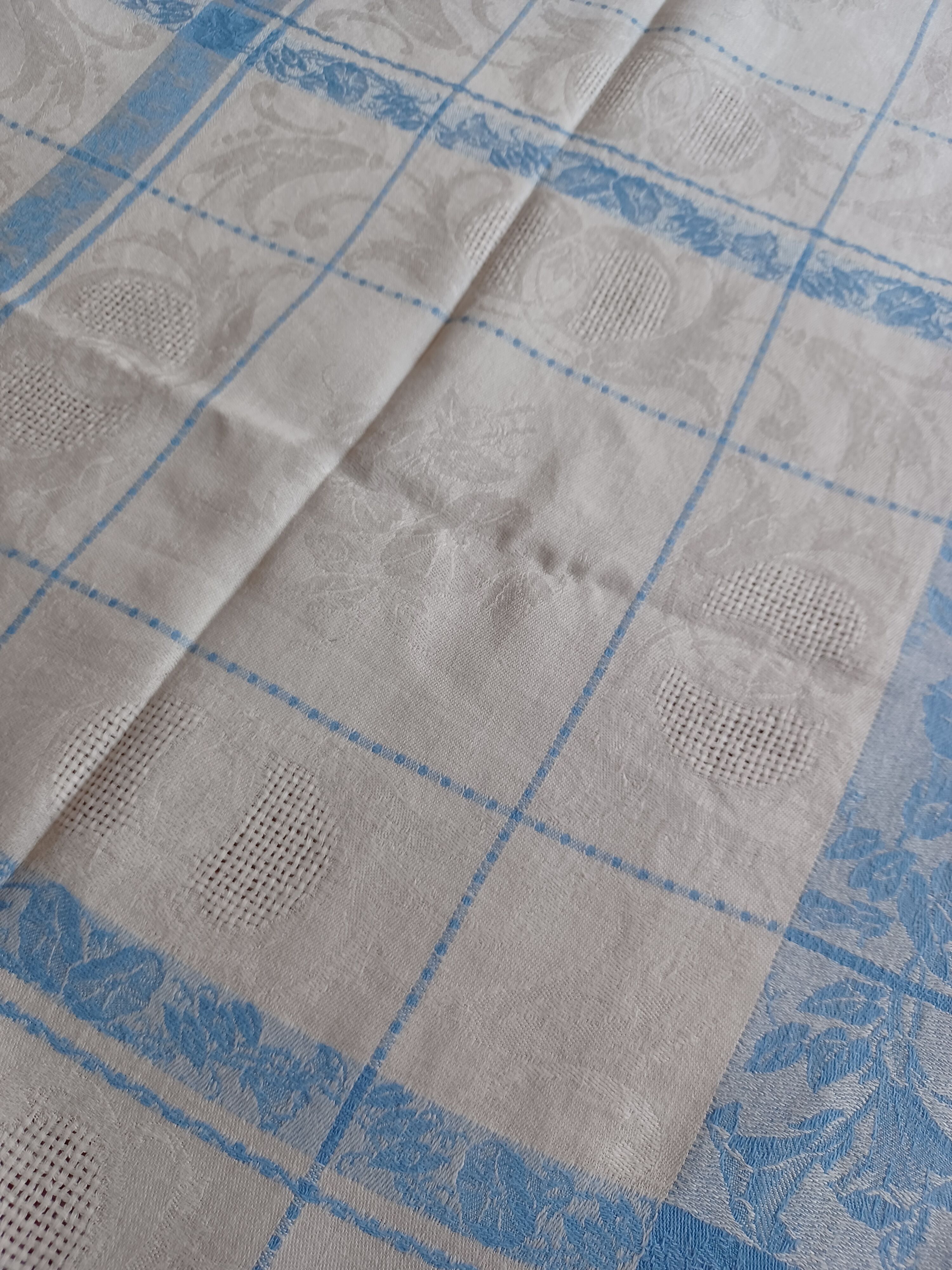 White and sky blue damask tablecloth and 10 towels