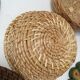 Wall composition of seven baskets and wicker trays.