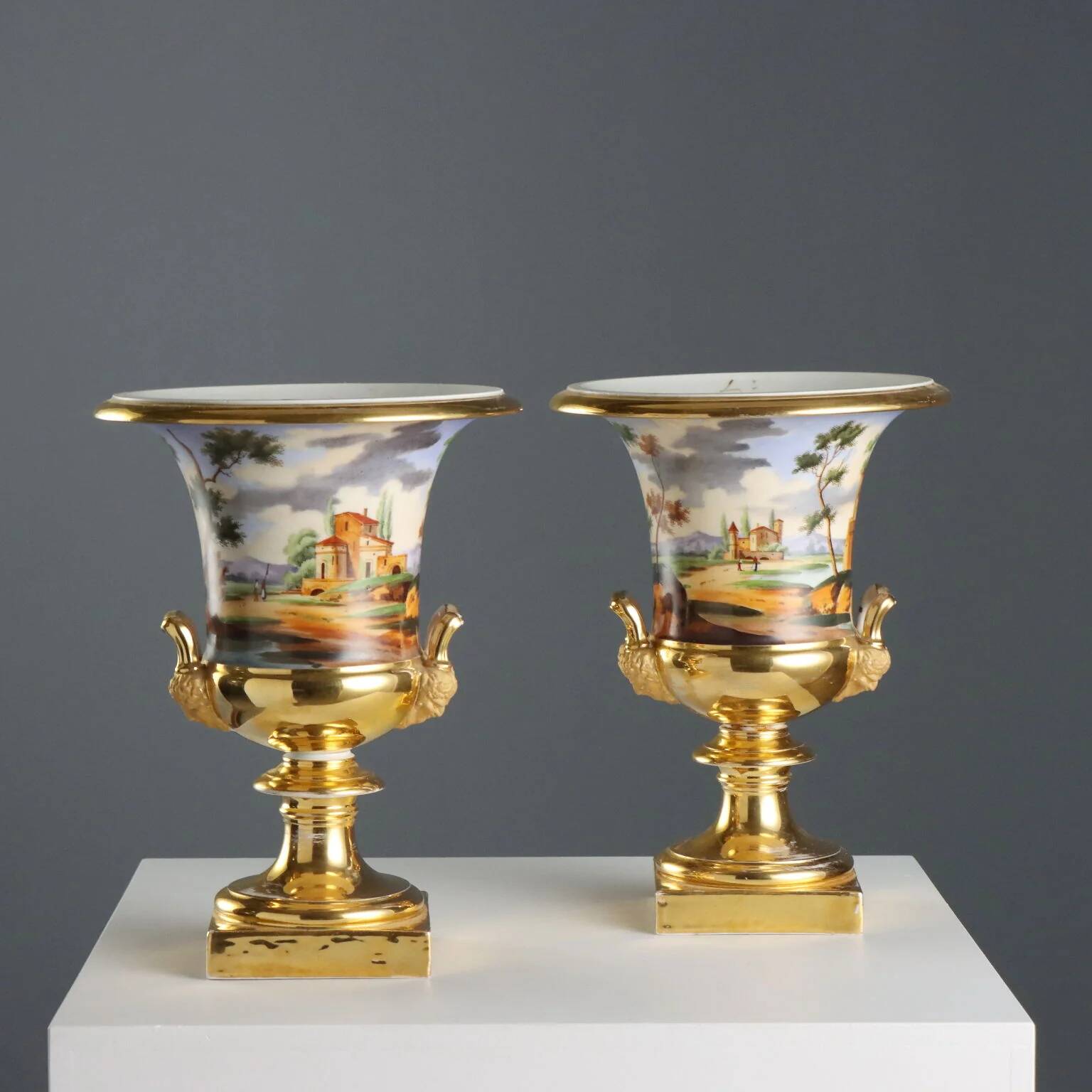 Pair of antique painted and decorated porcelain vases, France, 19th century.