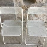 Pair of white perforated metal folding chairs - vintage