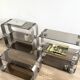 Stainless steel and smoked glass shelves by Donald Singer