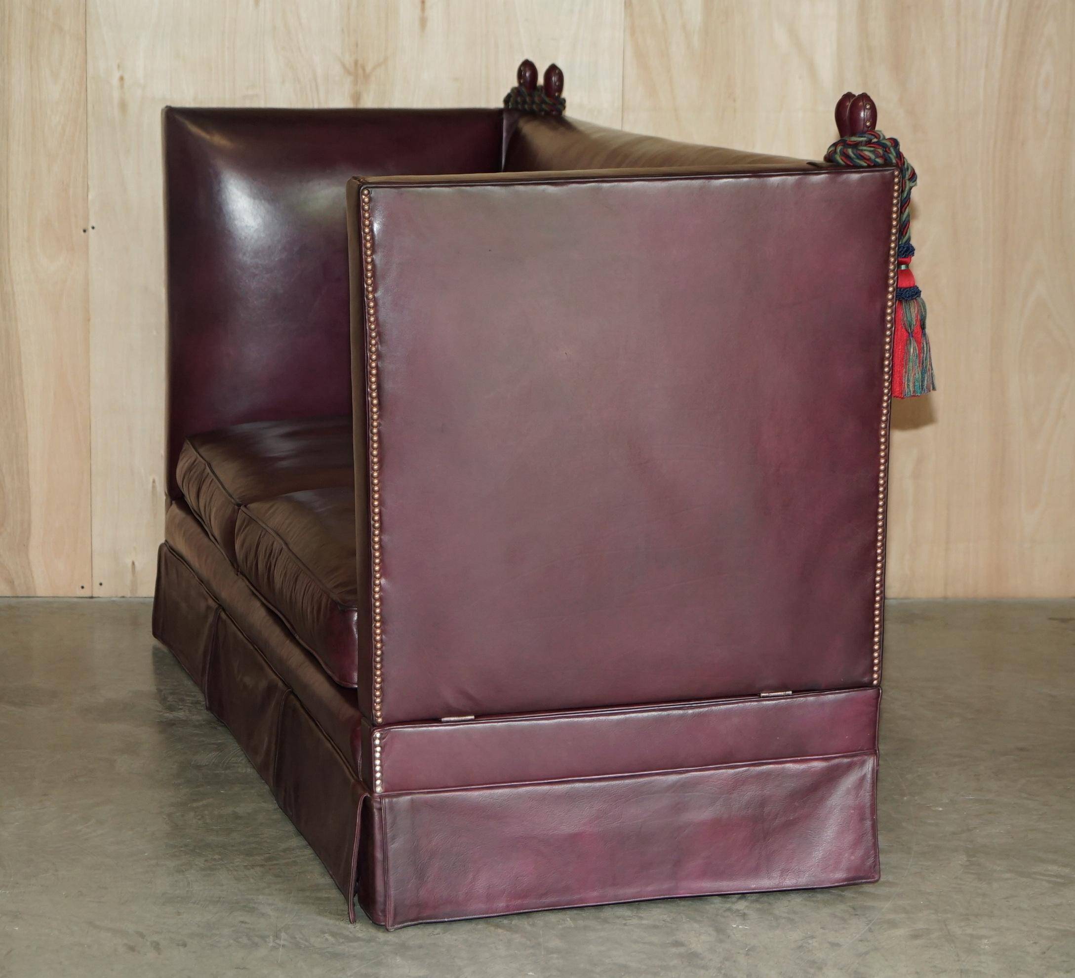Victorian Knole canapé restored in leather with feather cushions.