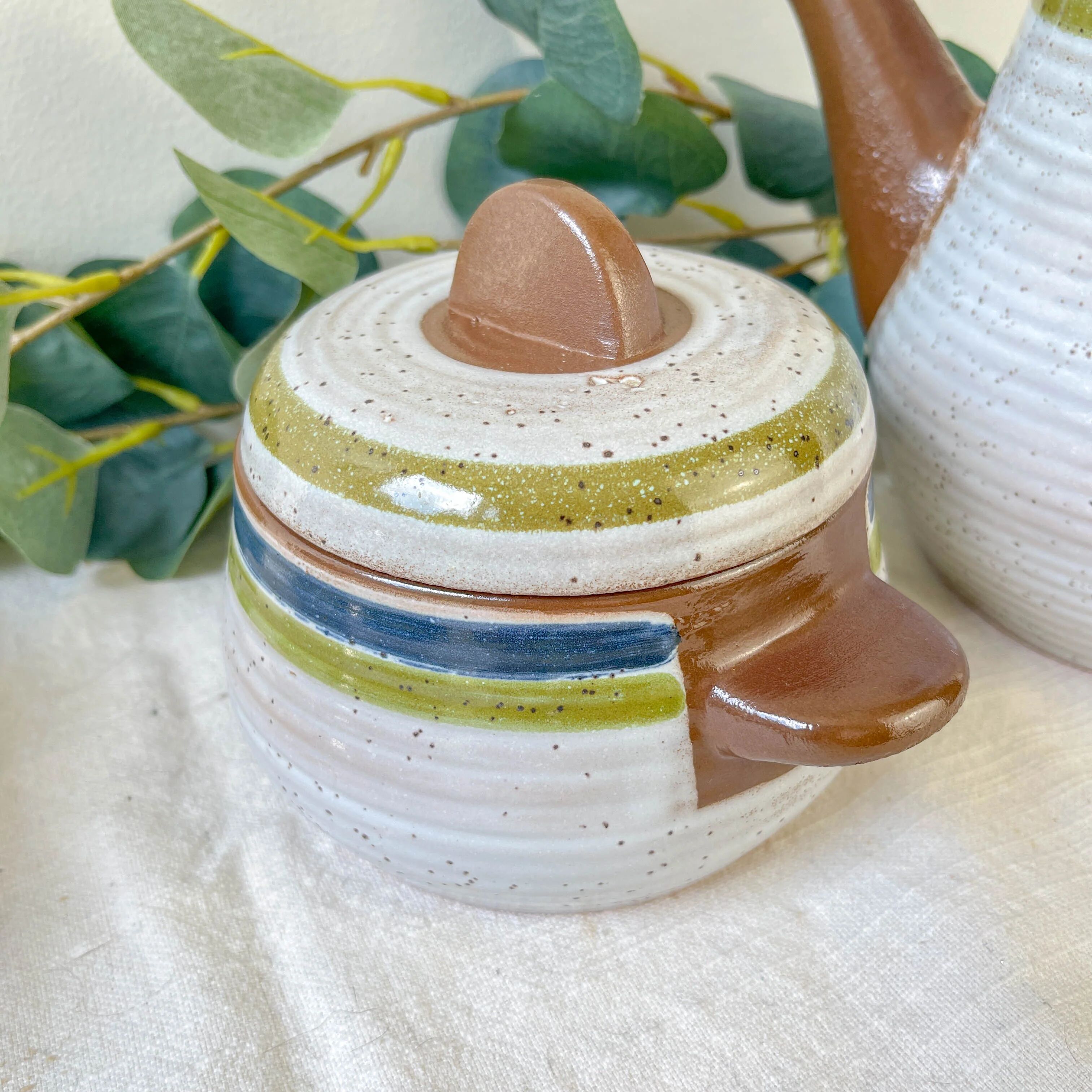 Vintage 1950s speckled stoneware coffee set with grey, green, and blue stripes