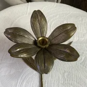 Flower candlestick and removable ashtrays in solid brass.