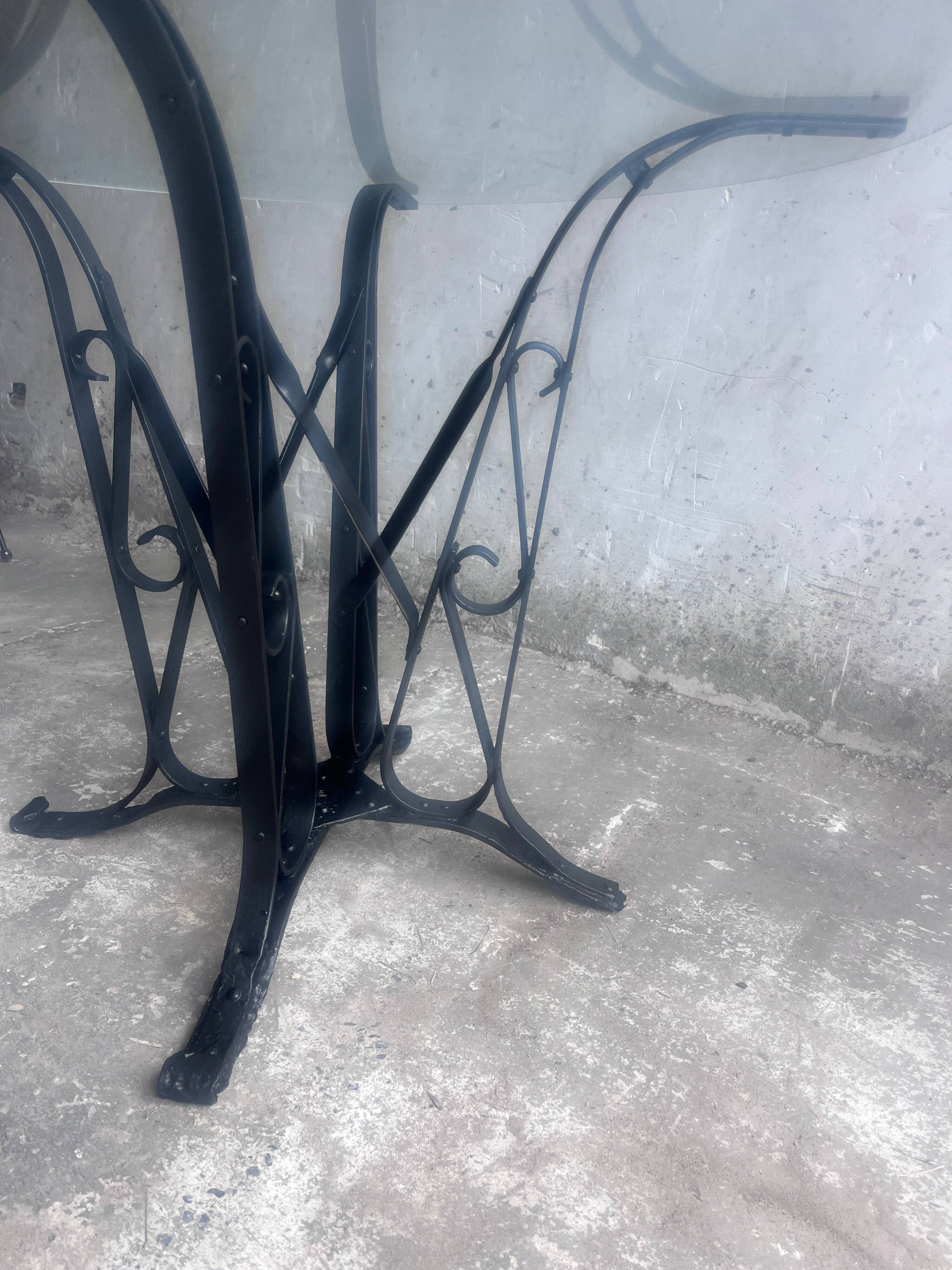 French Art Deco dining table in wrought iron and glass, circa 1930.