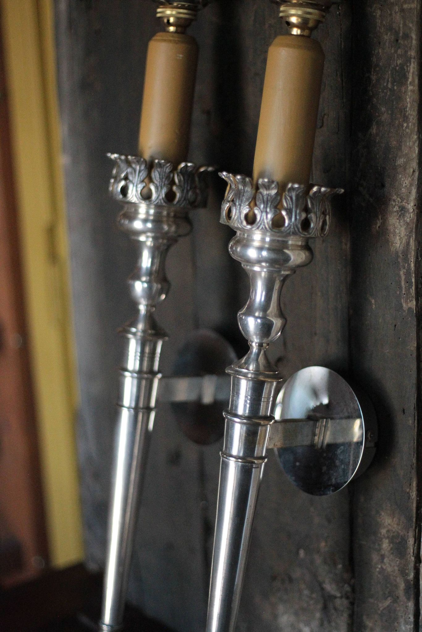 Large pair of silver-plated wall lights with flame globes, torches.