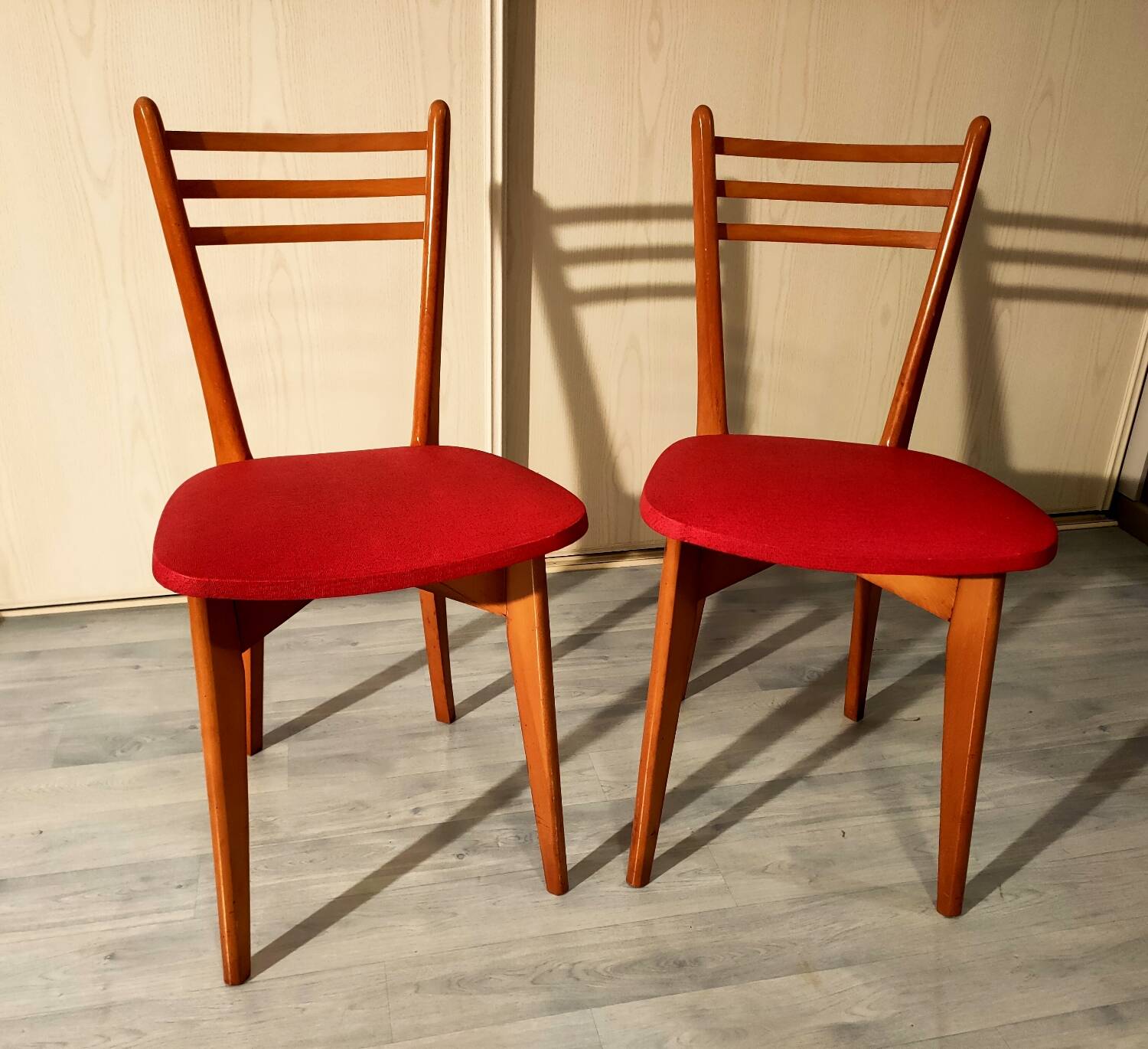 Pair of vintage wooden and leatherette chairs