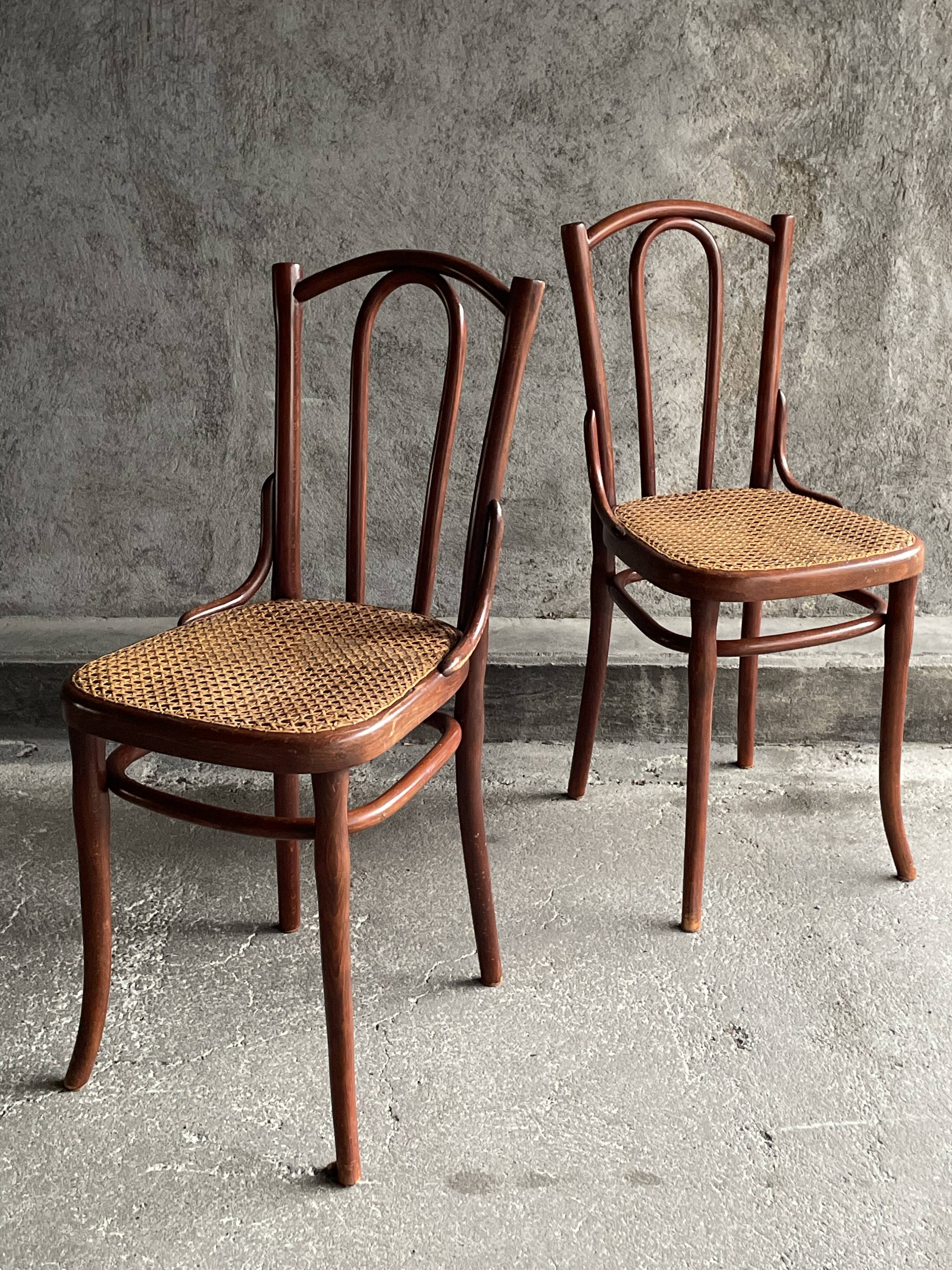 Pair of caned bistro chairs by Thonet