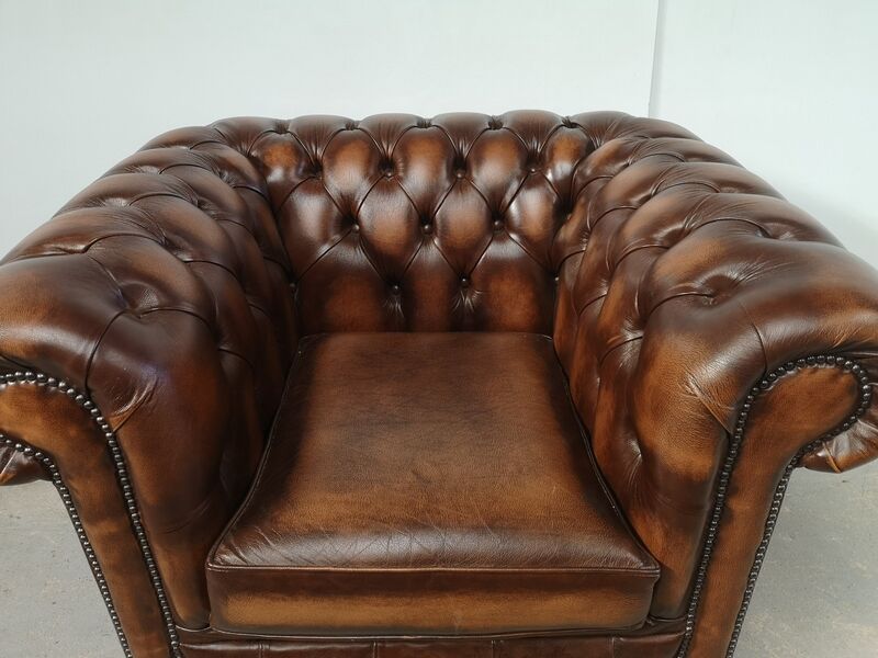 Brown leather chesterfield armchair