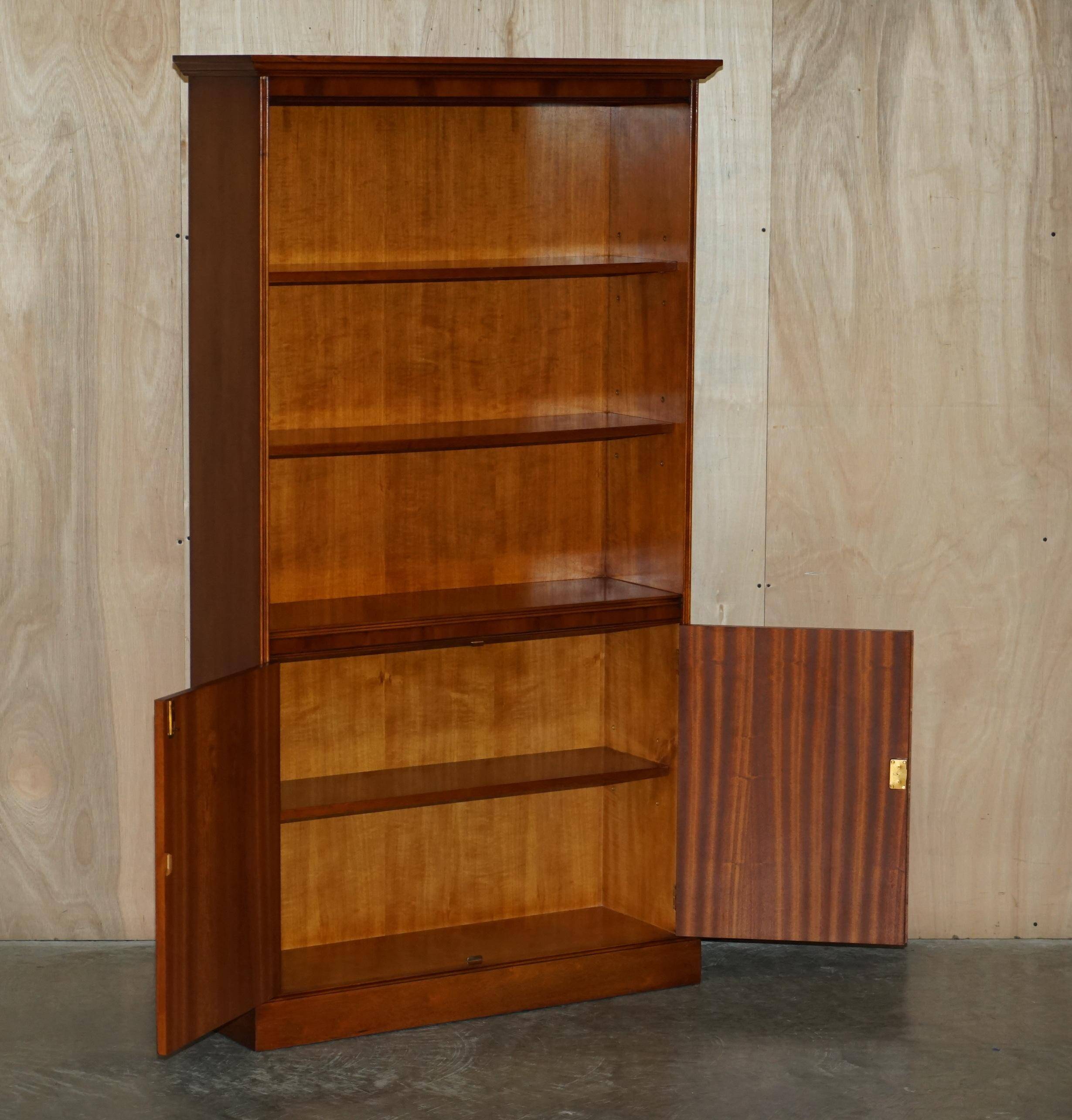 Open library Bradley Furniture made of yew wood with a cupboard base.