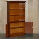 Open library Bradley Furniture made of yew wood with a cupboard base.