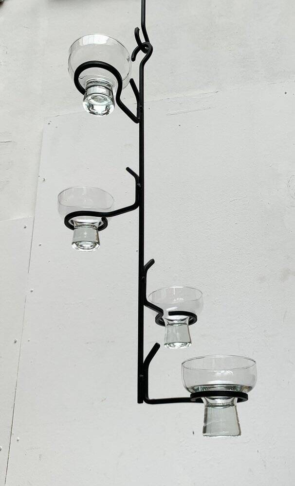 Mid-century metal and glass pendant light from the 1960s.