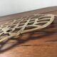 Under the nice brass dish.