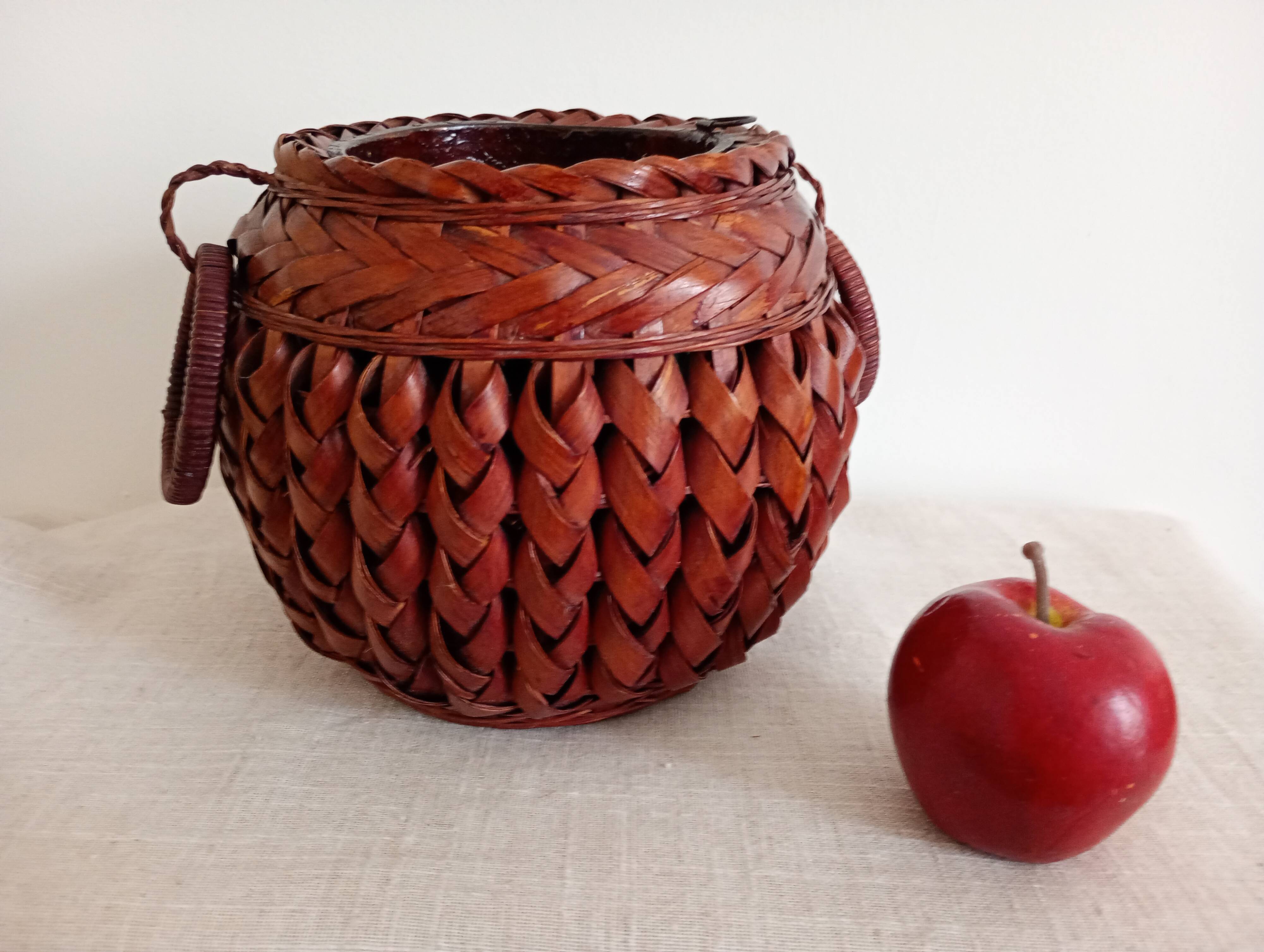 Japanese vase made of woven bamboo. Ikebana.