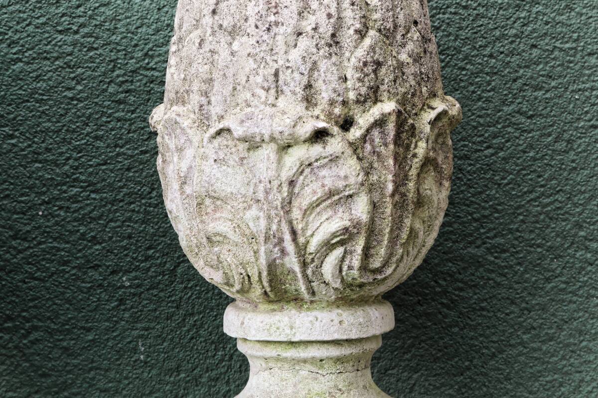 Pair of pine cones in reconstituted stone