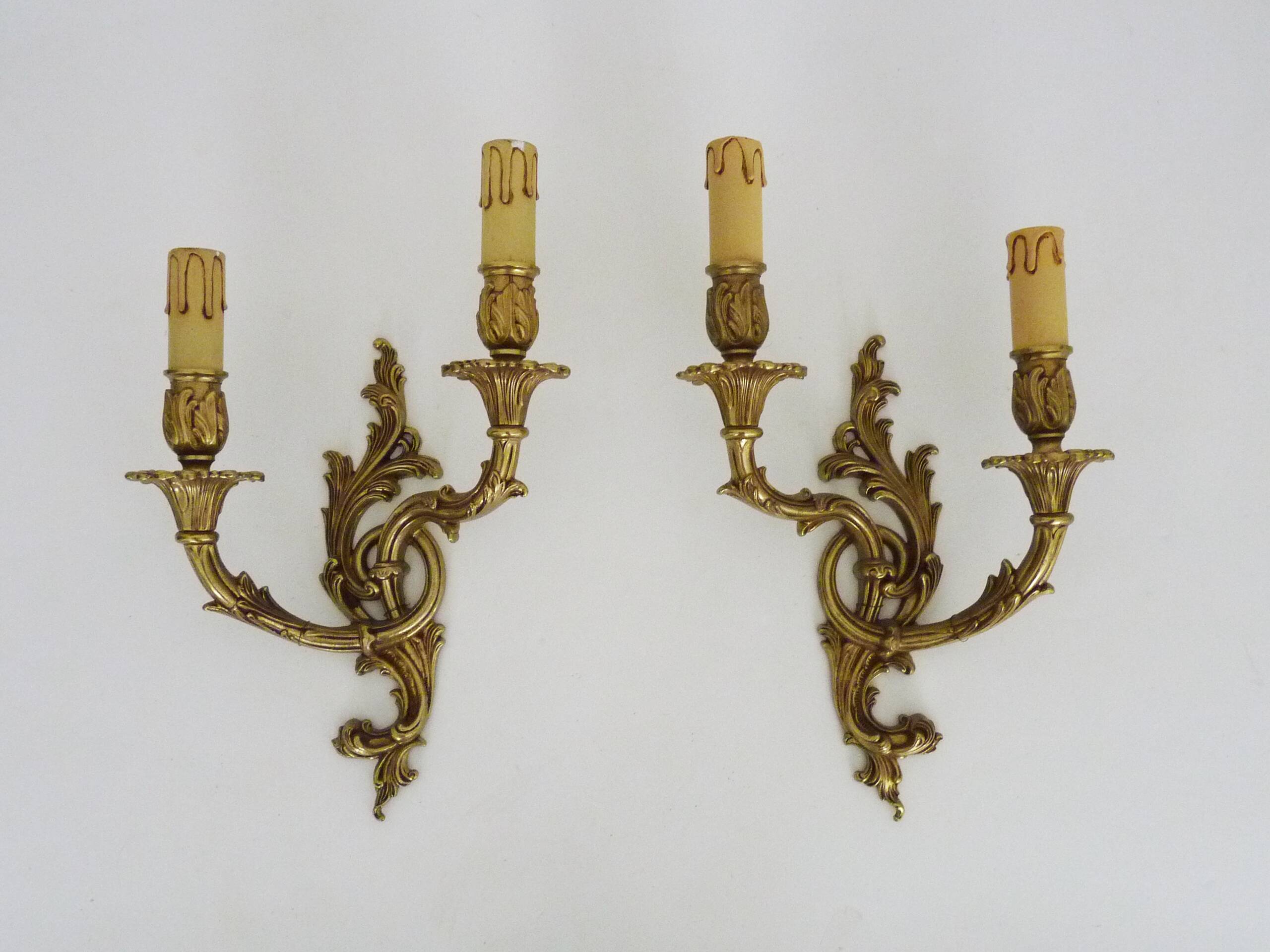 Vintage pair of double wall sconces in bronze from the 1960s.