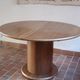 Round table with a central pedestal, light wood, 1990s.