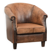 Vintage sheepskin club armchair with character and a beautiful patina