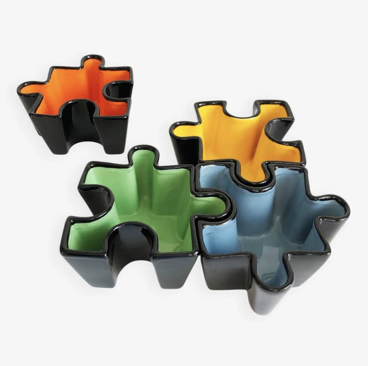 Set of ceramic puzzle pocket trays. Italy, 1980s.