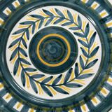 Painted and enamelled ceramic plate