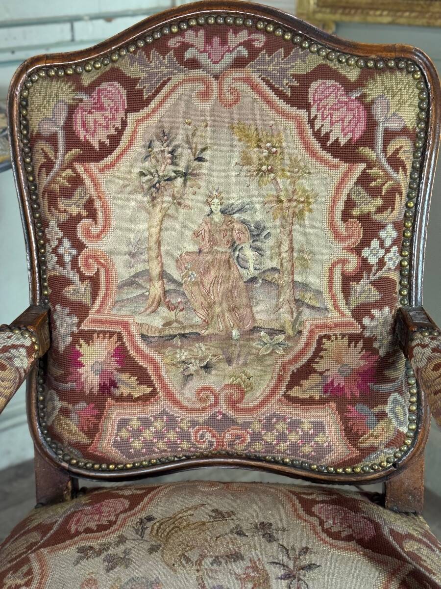 Louis XV armchair in carved walnut, needlepoint tapestry, 18th century