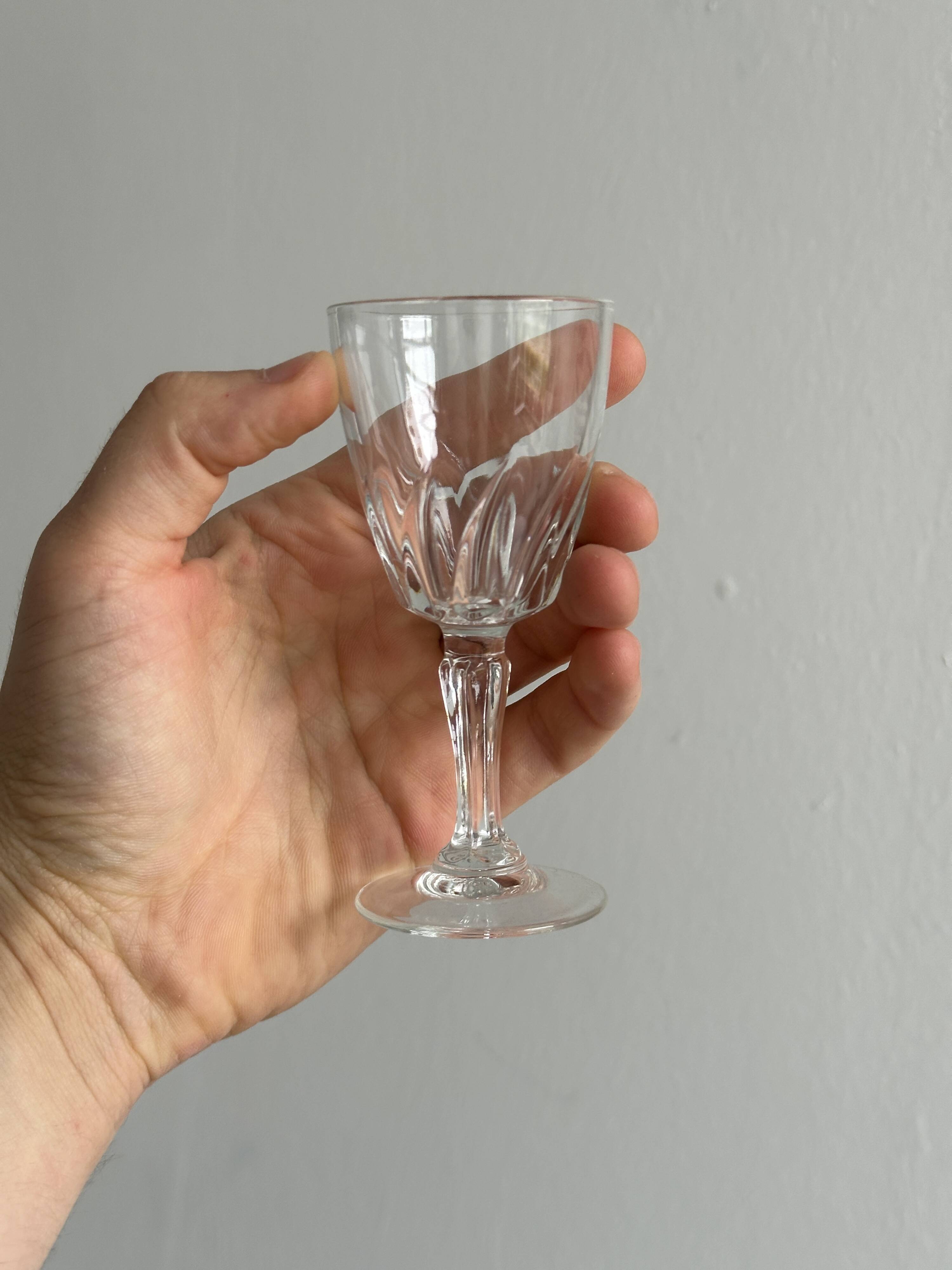 5 clear crystal liqueur glasses.