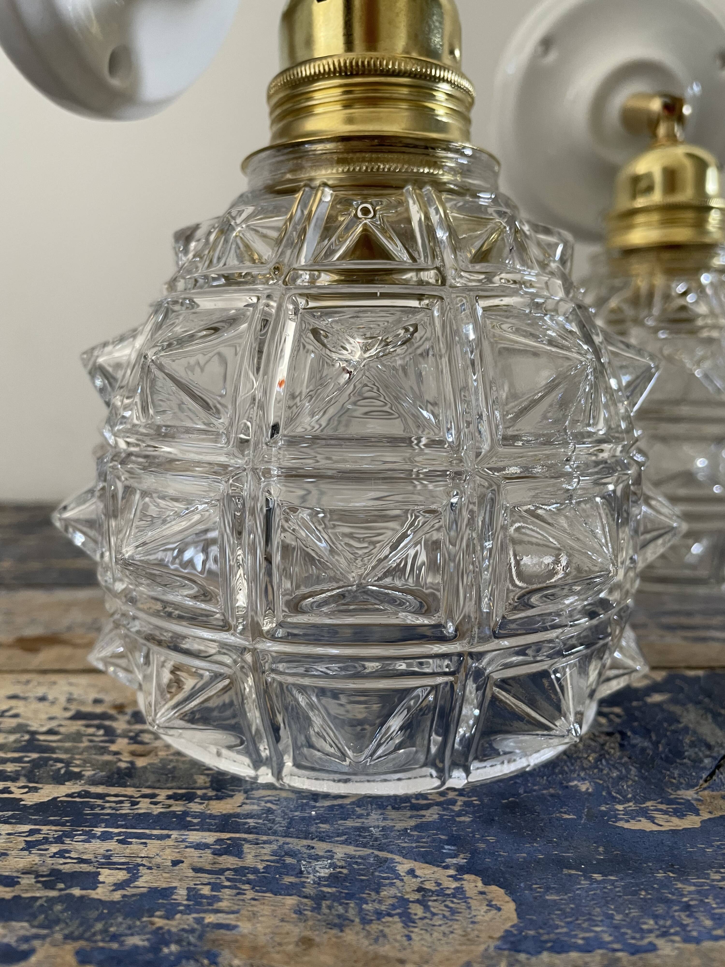 Pair of new electrified chiseled glass sconces