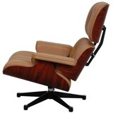 2-piece lounge chair with footstool, caramel, red leather, designed by Eames