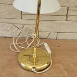 Articulated brass and opaline lamp.