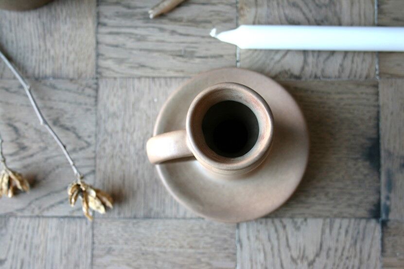 Hand-held sandstone candlestick