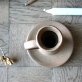 Hand-held sandstone candlestick