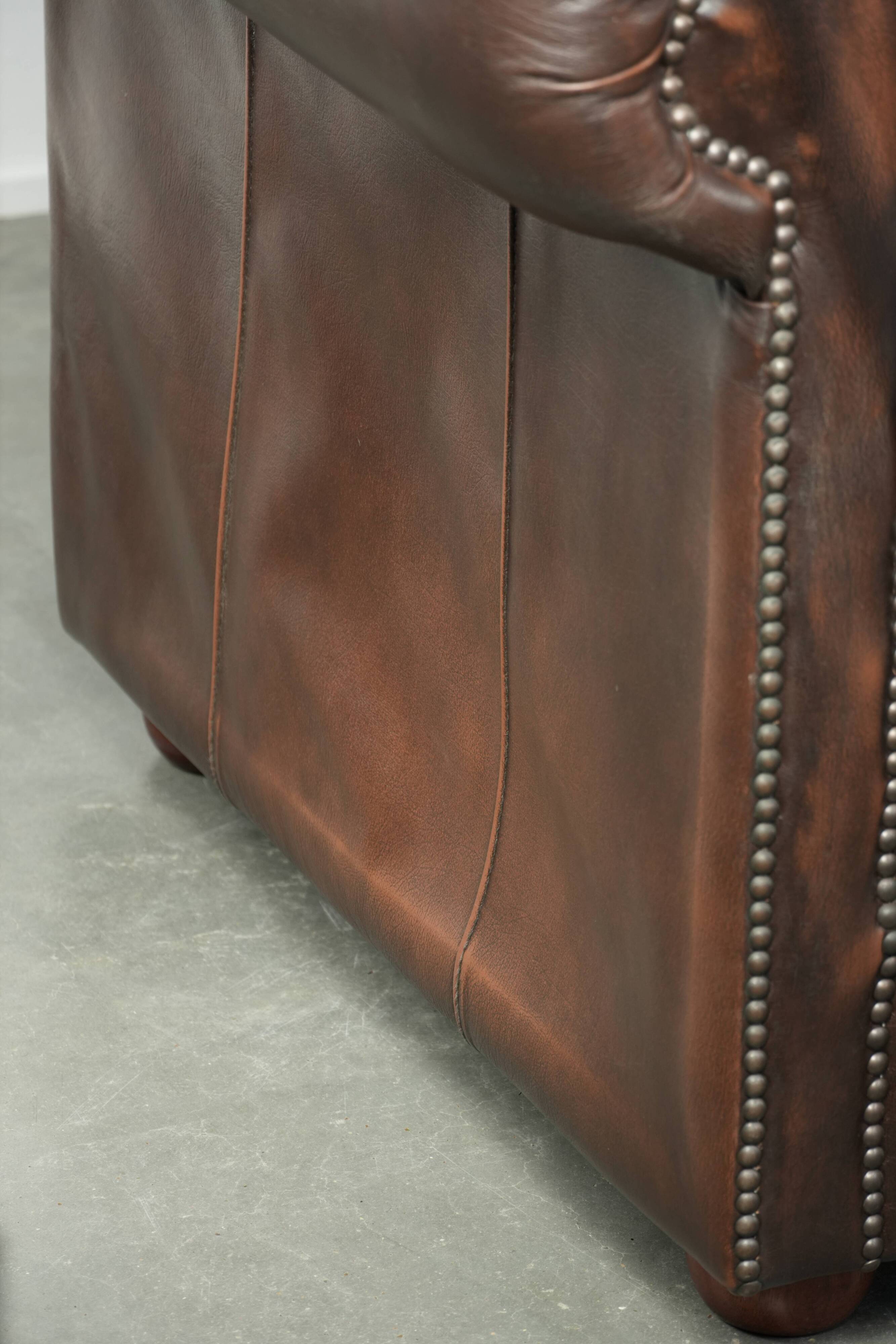 Luxury brown smooth cow leather Chesterfield sofa with an English look