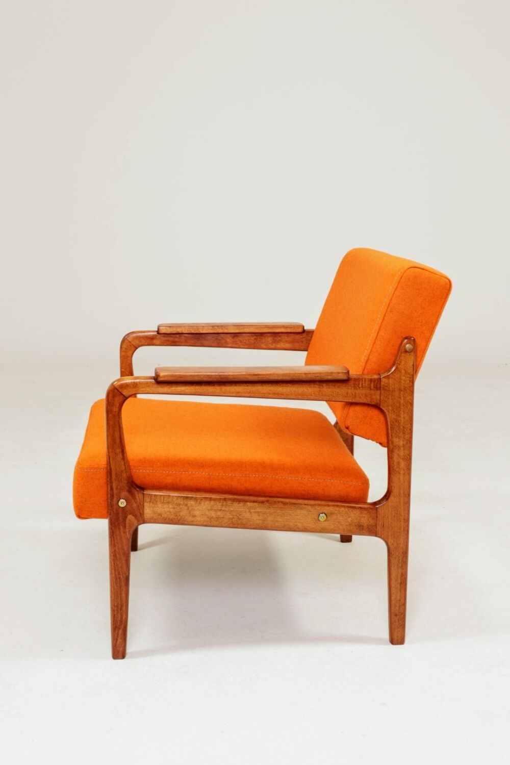 Vintage armchair in papaya orange wool from the 1960s.