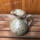 Old vintage brown stoneware pitcher