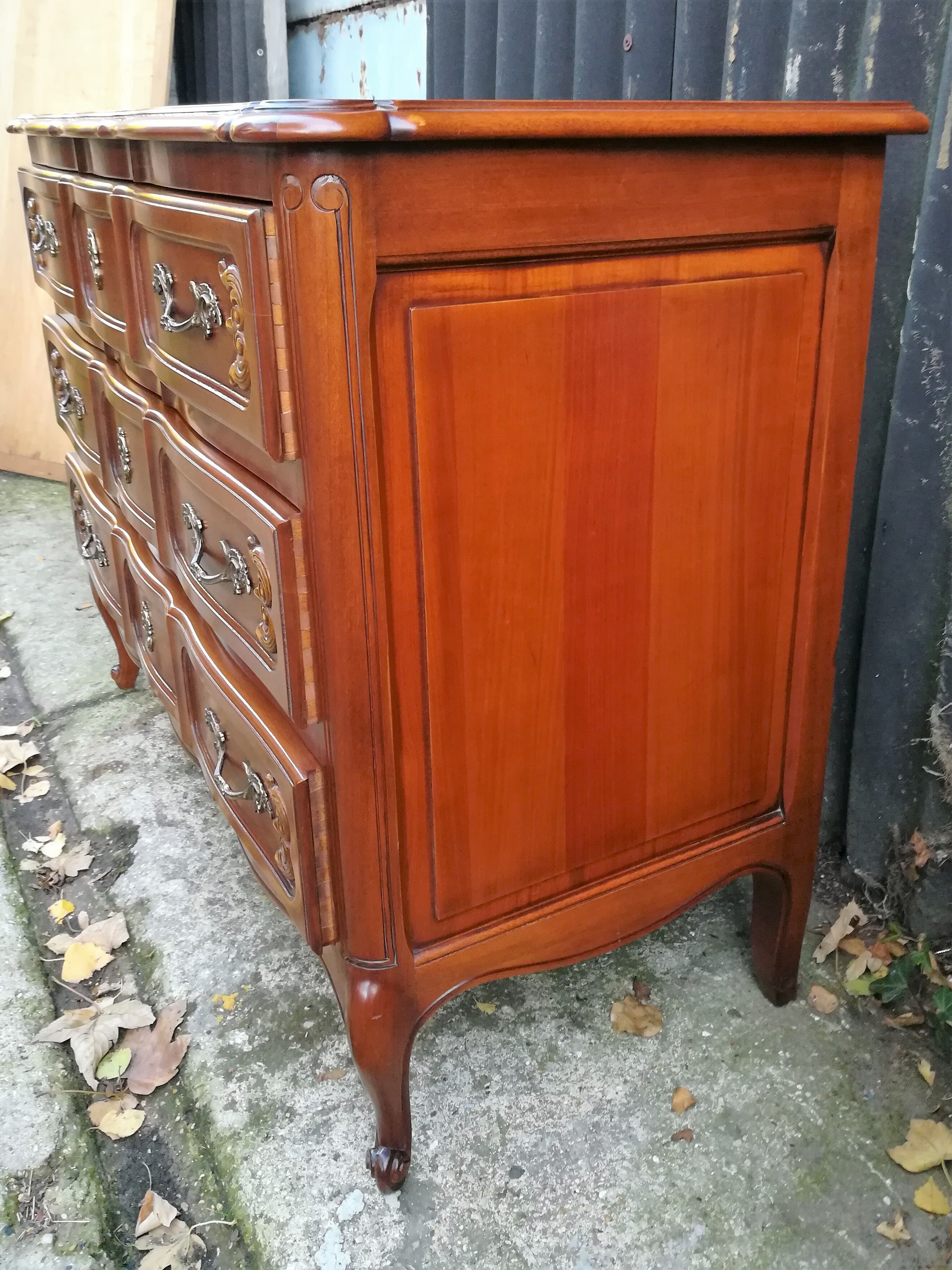 Louis XV style crossbow chest of drawers in cherry wood