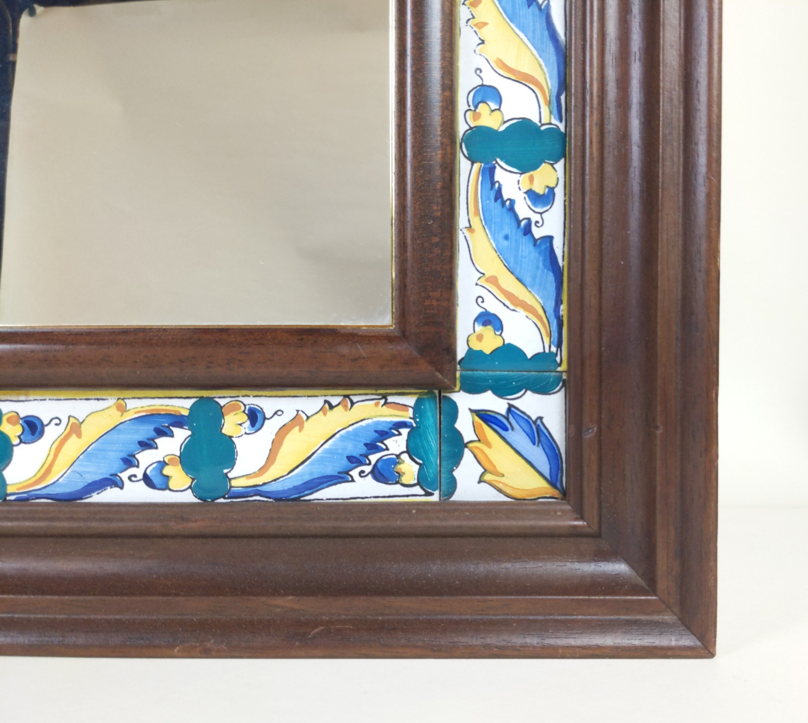 Mirror with wooden frame and painted ceramic tiles