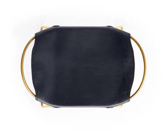 Pair of navy blue bar stools with gold brass finishes.