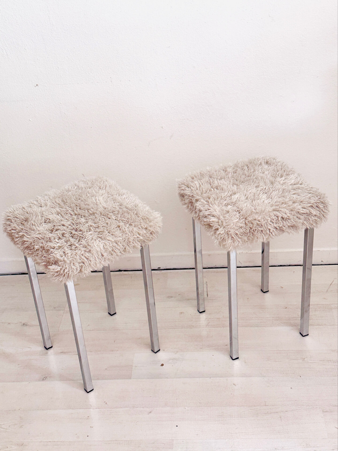Set of two vintage chrome stools with fluffy upholstery