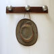 Wooden and stainless steel coat holders from the 1920s