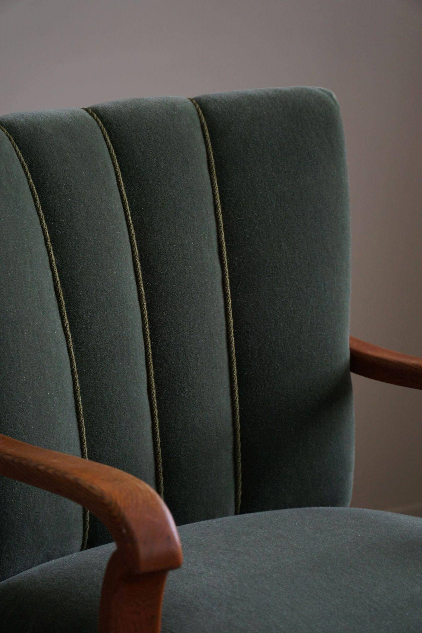 Danish Art Deco, set of 3 oak armchairs, reupholstered in green mohair, 1930s.