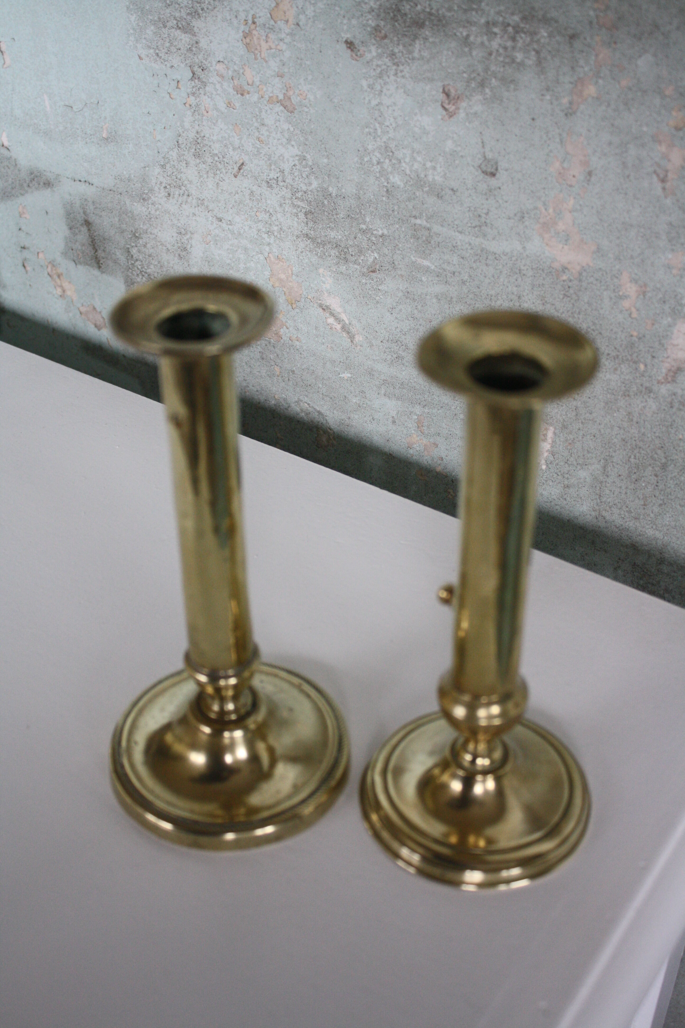 Pair of brass push-up candlesticks