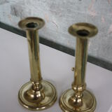 Pair of brass push-up candlesticks