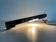 Minimalist black metal wall light with a cylindrical design, 1960s, Germany.