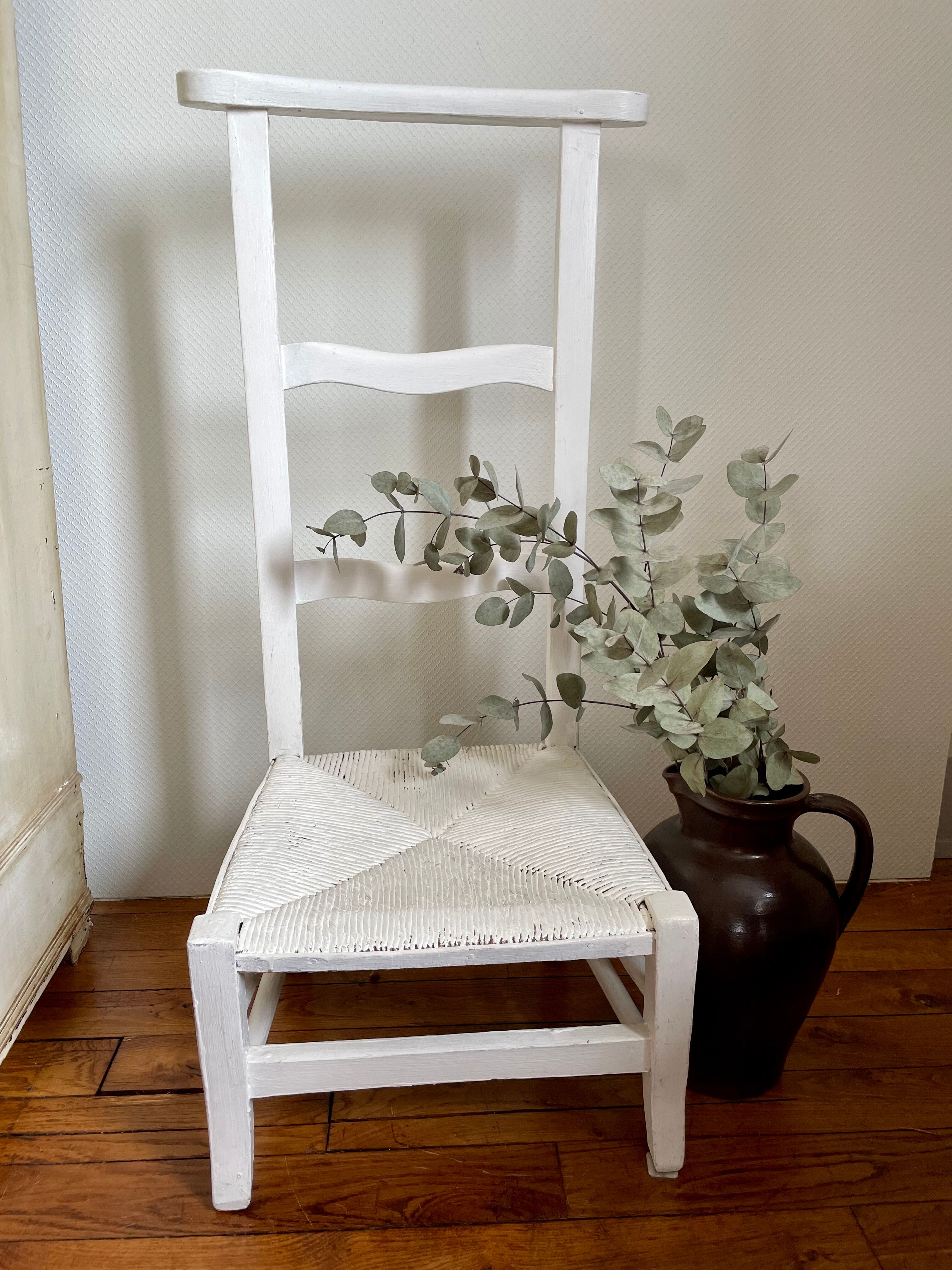Old white mulched wooden chair