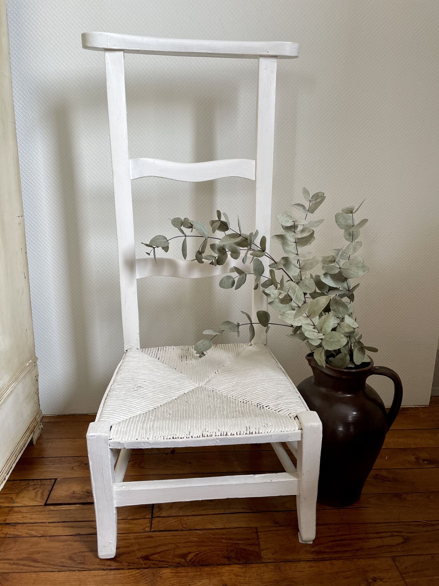 Old white mulched wooden chair