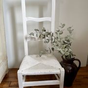 Old white mulched wooden chair